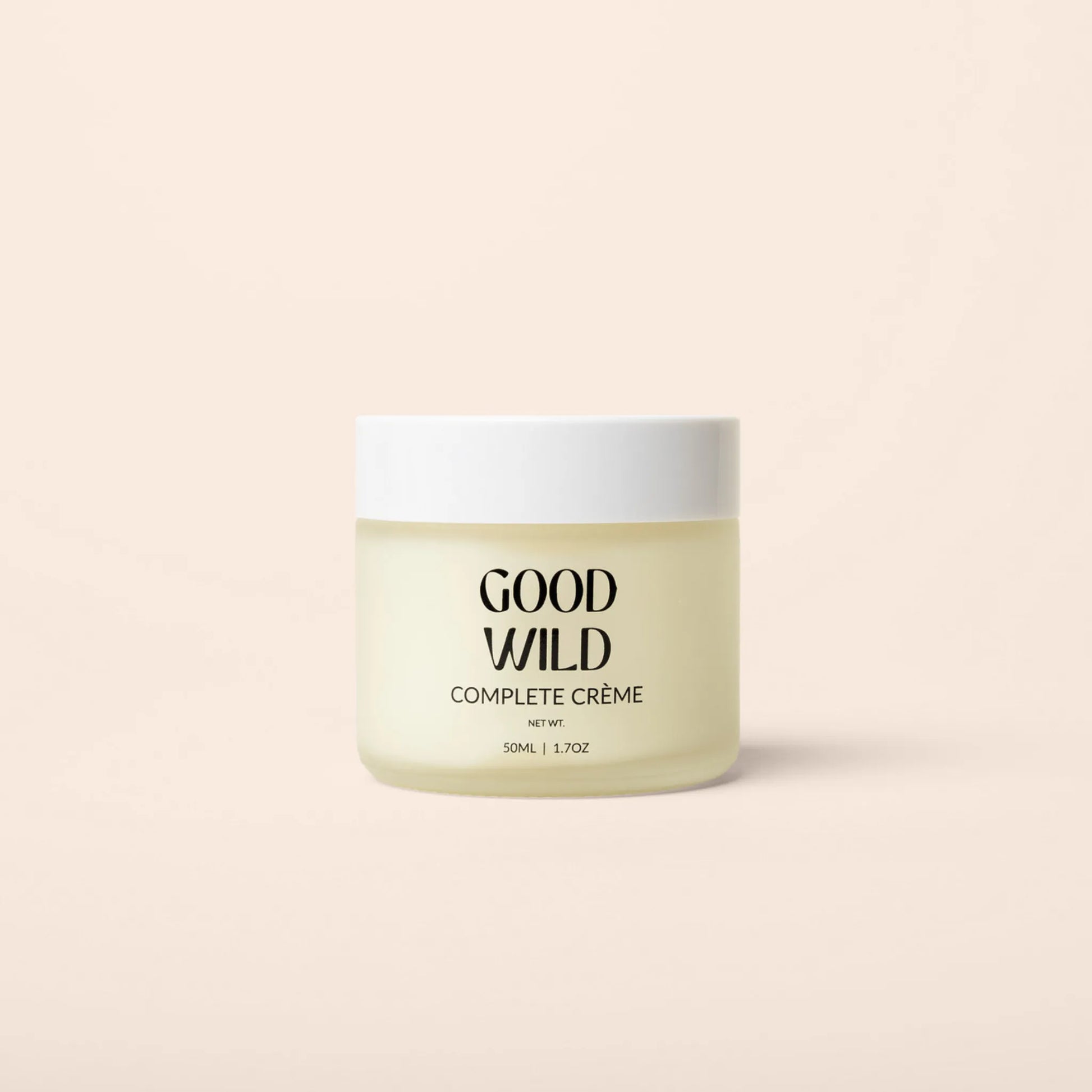 Jar of Good Wild Complete Crème on a beige background