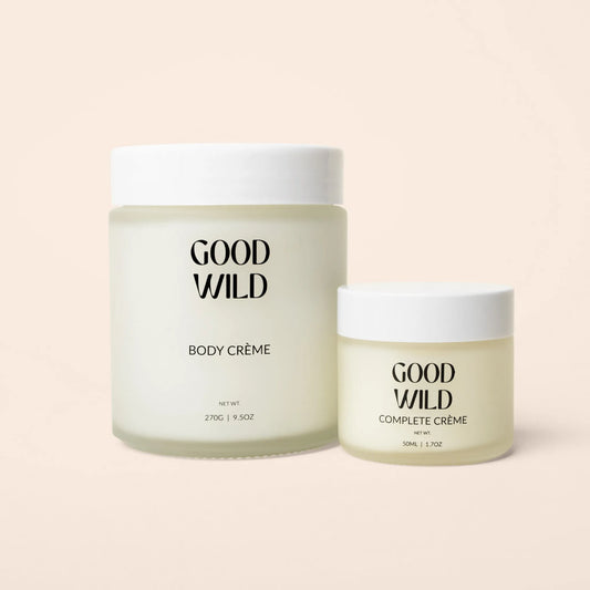 Two jars of 'Good Wild' body and complete crème on a light pink background